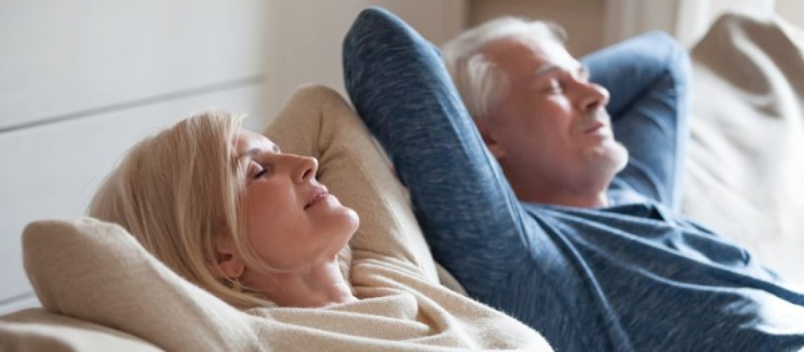 calm-mature-couple-relaxing-on-sofa-having-daytime-nap-together-picture-id1049512746 (1)