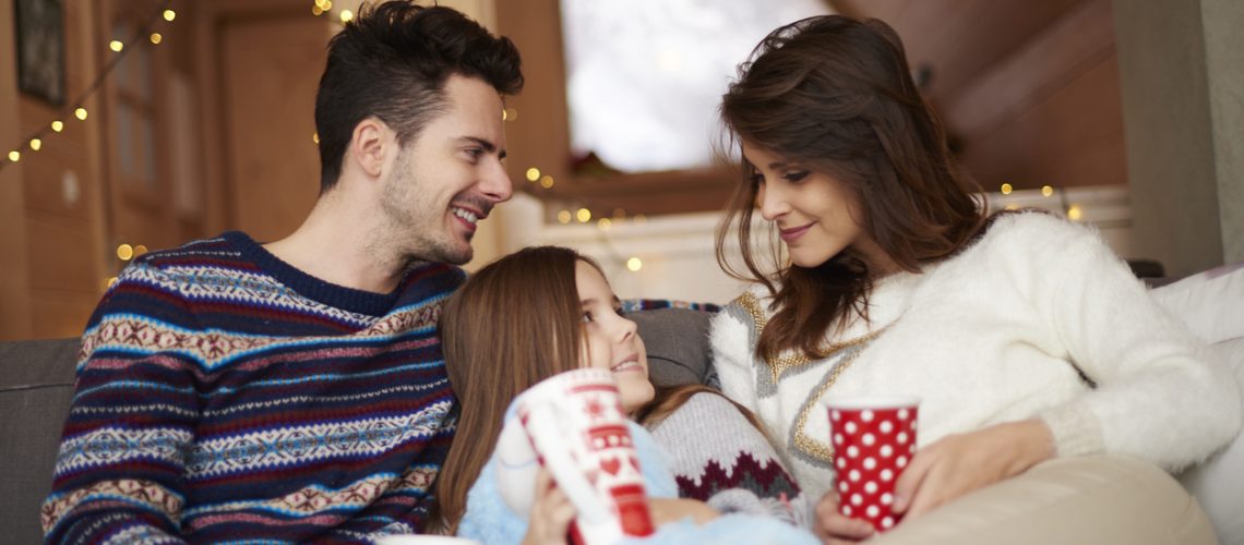 Happy parents with their little daughter