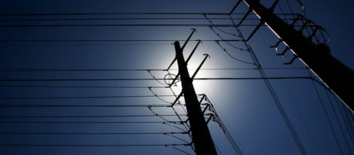 maze-of-power-lines-against-deep-blue-sky-picture-id179268840 (1)